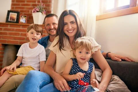 Nothing can replace family time. Portrait of a happy young family of four Stock Photos