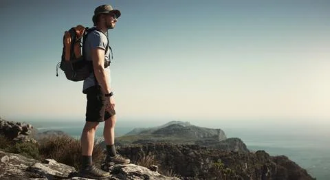Nothing can replace time spent in nature. a mature man hiking up a mountain. Stock Photos