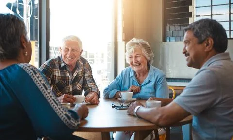 Nothing changed over the years...senior couples on a double date at a cafe. Fotos Stock