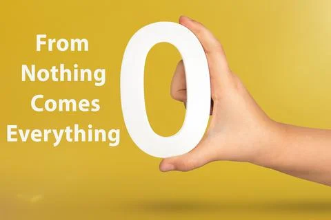 From Nothing Comes Everything. Close-up concept photo of a hand holding a white Foto stock