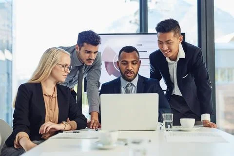 Nothing completes a task better than teamwork. a group of young businesspeople Foto stock