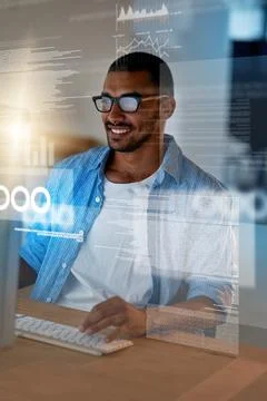 Nothing makes him happier than working code. a happy computer programmer working Stock Photos