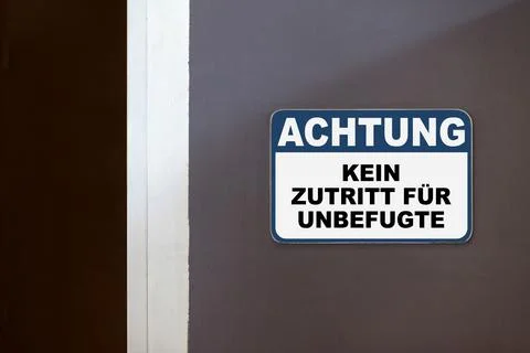 Notice, No access for unauthorized persons - Sign written in German Stock Photos