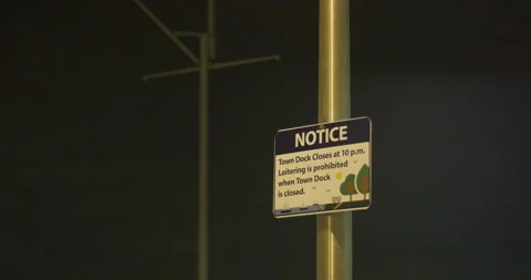 Notice sign at night Stock Footage 219828656