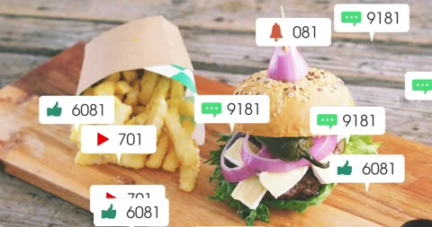 Notification bubbles appearing then clustering over burger and fries, then Stock Footage 328384224