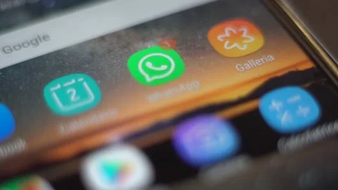 Notification at WhatsApp application on screen of an smartphone Stock Footage 131700104