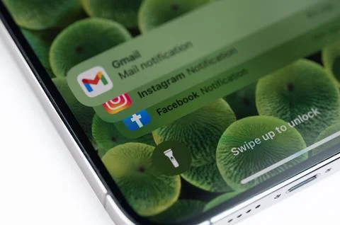 Notifications on locked iPhone screen Stock Photos