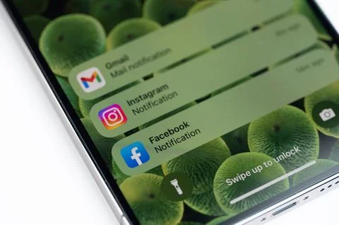 Notifications on unlocked iPhone screen Stock Photos