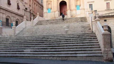 Noto sicily italy front steps leading to church tilt up to church Stock Footage 252155154