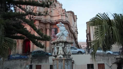 Noto sicily italy statue monument of person drinking with zoom in Stock Footage 252155283