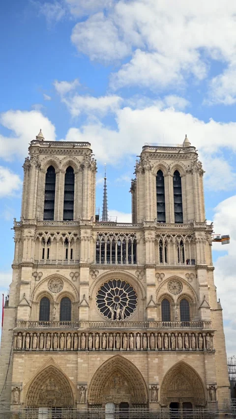 Notre Dame cathedral facade viewed from below with clouds and sky in backgr.. Stock Footage 339650293