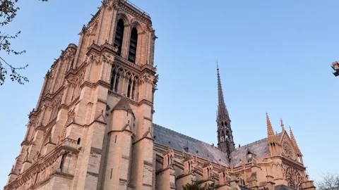 Notre Dame Cathedral Glowing in Warm Evening Light, Paris, France Stock Footage 340298364