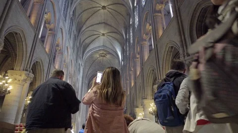 Notre Dame Cathedral interior upward angle tourists taking photos inside Paris Stock-Footage 94427997