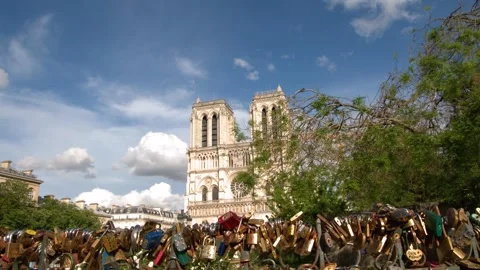 Notre Dame Cathedral with Love Locks on Bridge in Paris 스톡 동영상 344517154