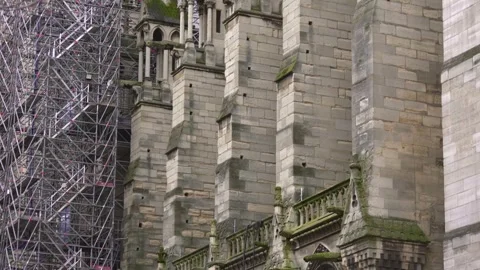 Notre Dame Cathedral stone facade with scaffolding during restoration works Stock Footage 317329605