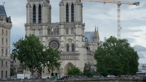 Notre Dame de Paris gothic cathedral architecture and historic river bridge Stock Footage 337293381