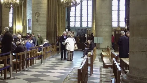 Notre Dame de Paris interior with prayers Stock Footage 72936481