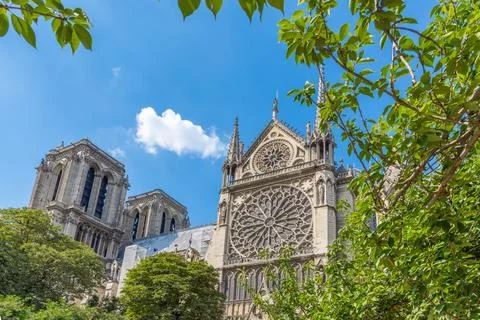Notre Dame de Paris under a blue sky with clouds 写真素材