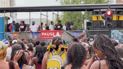 Notting Hill Carnival dense crowd beneath sound system stage Stock Footage 344399258