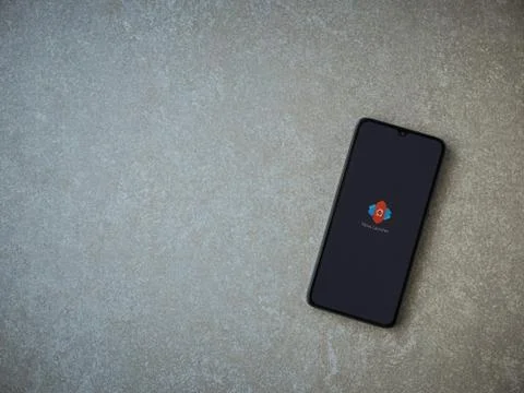 Nova Launcher app launch screen with logo on the display of a black mobile sm Stock Photos