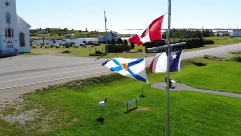 Nova Scotia, Acadia, Canada Flags in Larrys River, Nova Scotia Stock Footage 140691083