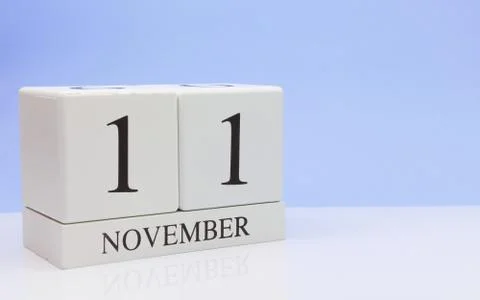 November 11st. Day 11 of month, daily calendar on white table with reflection Фото