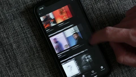 NOVEMBER 4, 2023: Navigating Spotify on an iPhone Stock Footage 255386145