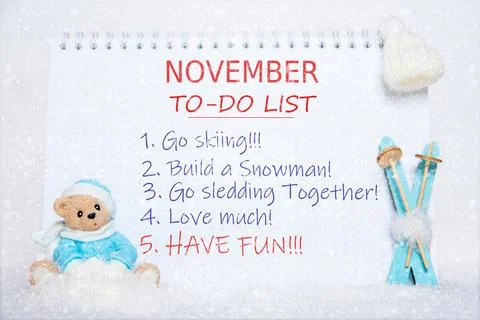 November to-do list. Notepad with to-do list: skiing, making a snowman, sledd Stock Photos