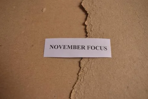 November Focus typography card on rustic kraft paper background Фото
