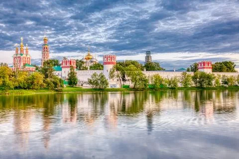 Novodevichy monastery with a reflection in the lake at sunset. The famous Mos Stock Photos