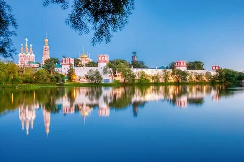 Novodevichy monastery with a reflection in the lake at sunset. The famous Mos Stock Photos