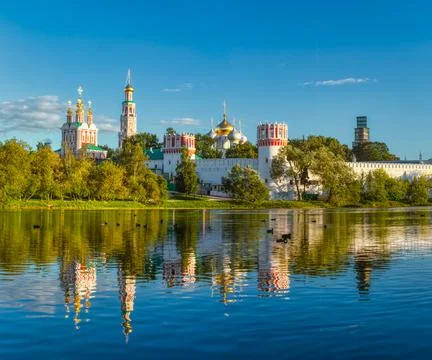 Novodevichy monastery with a reflection in the lake at sunset. The famous Mos Stock Photos