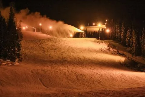 Now Cannons Making Artificial Snow on Ski Slope at Night in Trysil, Norway Stock Photos