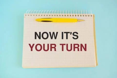 Now it's your turn text, inscription, phrase written in a notebook Business c Stock Photos