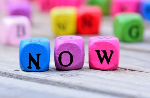 Now word on table Stock Photos