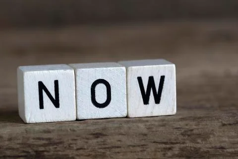 Now, written in cubes Foto stock