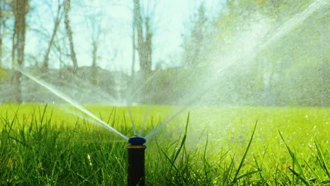 Nozzle for spraying water by automatic watering system for lawn. Slow motion. HD Stock Footage 88430609