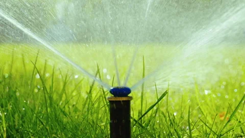 Nozzle for spraying water by automatic watering system for lawn. Slow motion. HD 库存影片 88430628