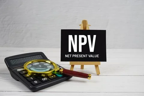 NPV abbreviation of Net Present Value text with magnifying glass and calcul.. Stock Photos