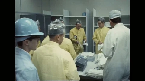 Nr engineers and astronauts looking at equipment - 1968 Stock Footage 104330948