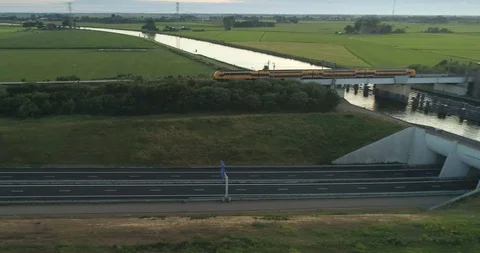 NS Train Crossing Bridge A32 Highway Netherlands / Holland 4K Drone Foo Stock-Footage 114890256