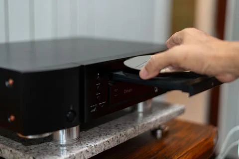 Nserting CD into Audio Player Stock Photos