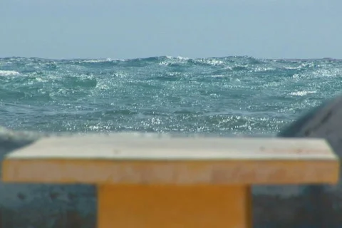NTSC: Concrete bench at the ocean Stock Footage 153545