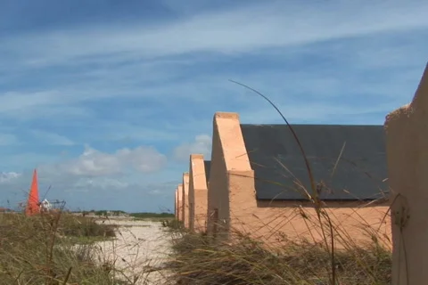 NTSC: Red Slave Huts Stock Footage 153511