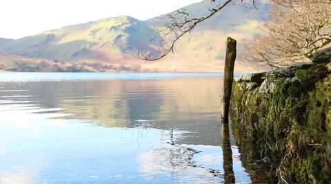 (NTSC) Reflections over beautiful water with stone pier - English Countryside Stock-Footage 41006892