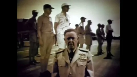 A nuclear device explodes into a mushroom cloud and a rear admiral describes a 動画素材 88828282