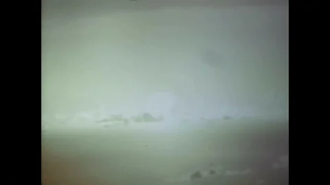 A nuclear device explodes into a mushroom cloud and a missile is launched, an 動画素材 88828366