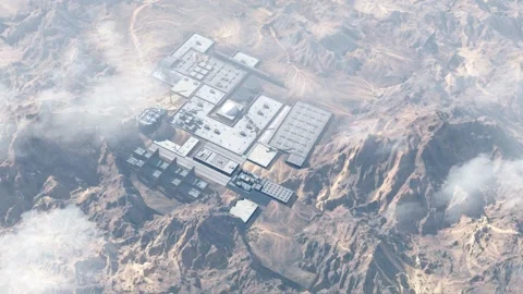 Nuclear facility hidden in the desert with mountains, Aerial Stock Footage 243213710