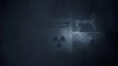 Nuclear Fallout Warning Sign on a Fence in a Storm Stock Footage