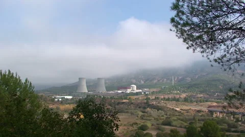 Nuclear hyperboloid cooling towers framed by trees Video stock 49953725
